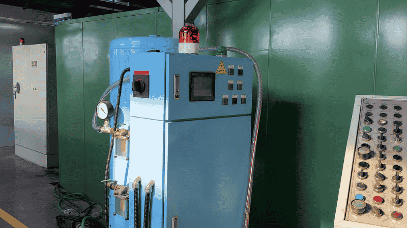 Vacuum die casting machine installed beside an industrial die casting production line