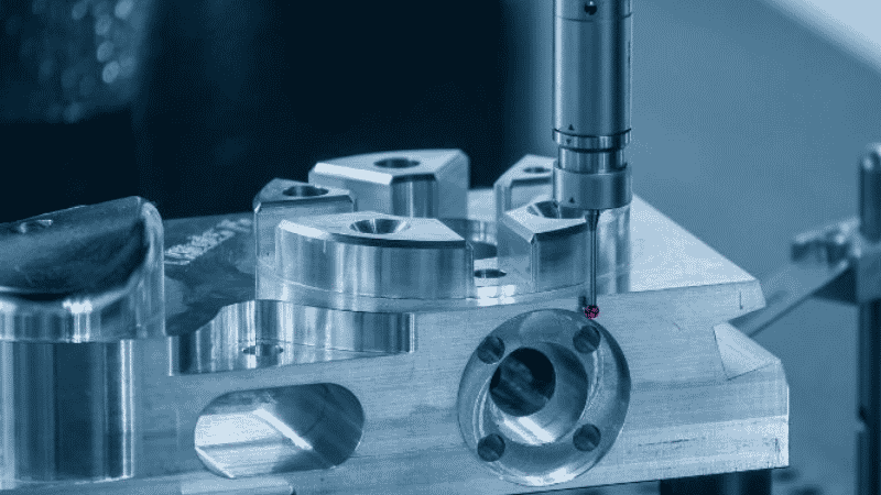 Coordinate measuring machine CMM inspecting precision die cast brass component with ruby touch probe, demonstrating dimensional tolerance verification for high-performance die casting